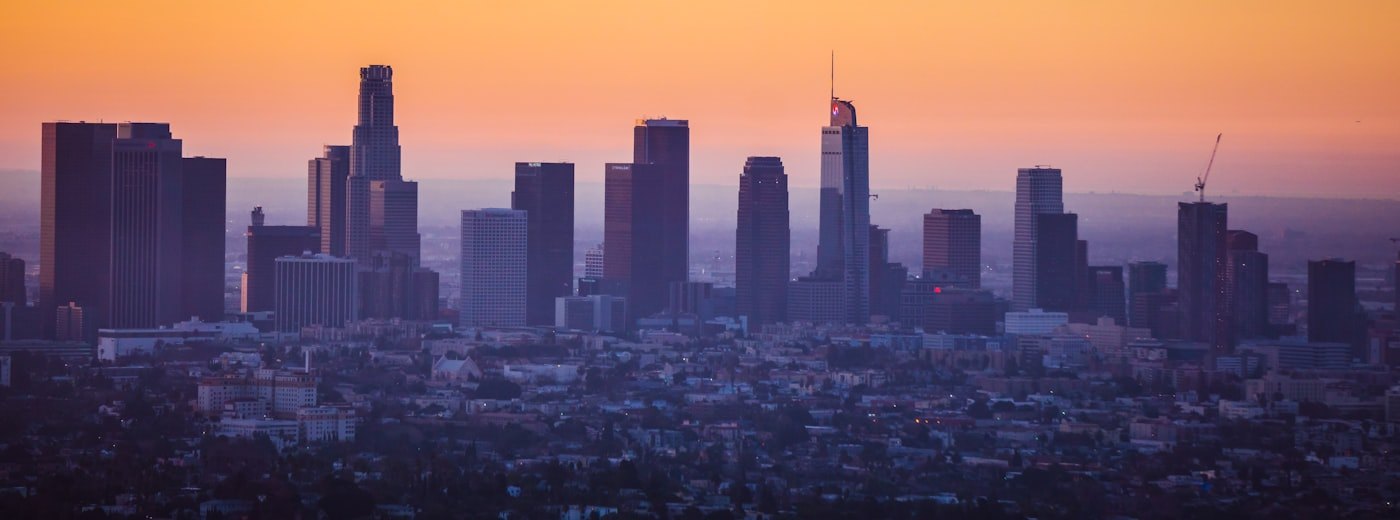 A city skyline at sunrise